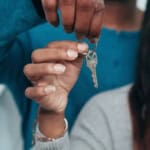 young couple house keys